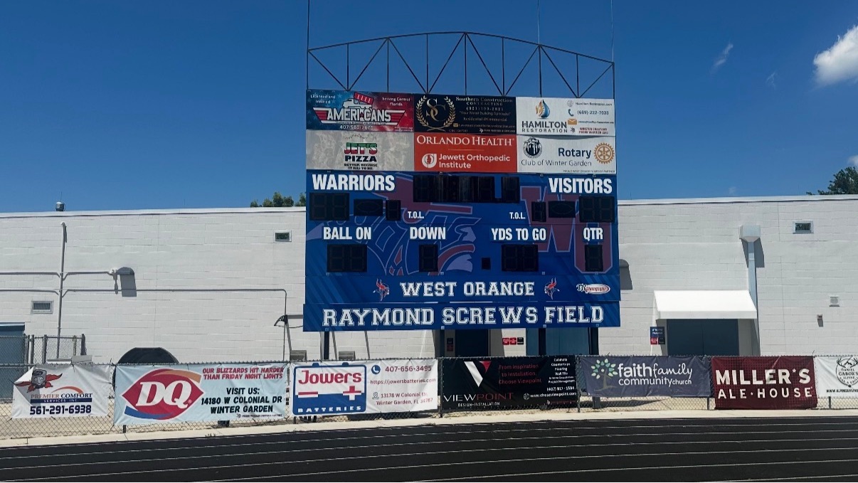West Orange Warriors scoreboard with sponsor placements for the Platinum Package